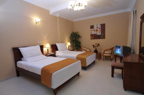Le Grand Hotel Doha Chambre photo